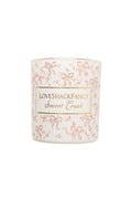 Blush scented candle with LoveShackFancy Secret Crush label and pink ribbon pattern