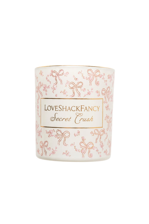 Blush scented candle with LoveShackFancy Secret Crush label and pink ribbon pattern
