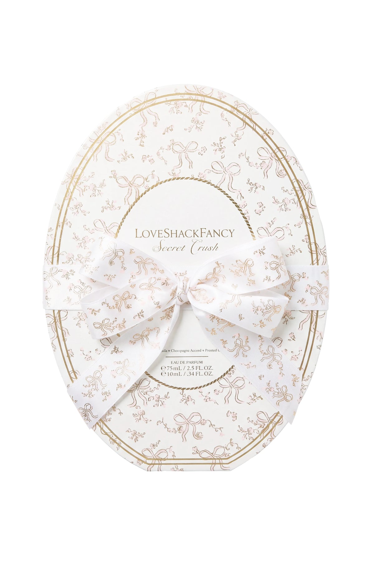 White and gold oval gift box with LoveShackFancy branding and bow ribbon, LoveShackFancy.