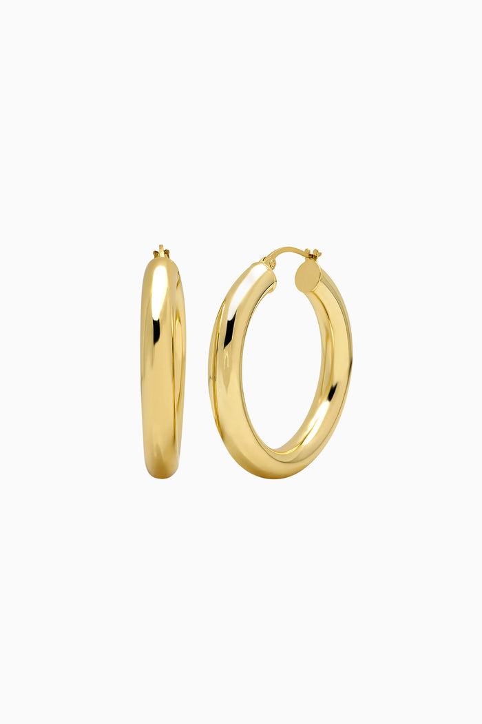 Gold hoop earrings on a white background
