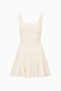 Beige dress with thin straps on a white background