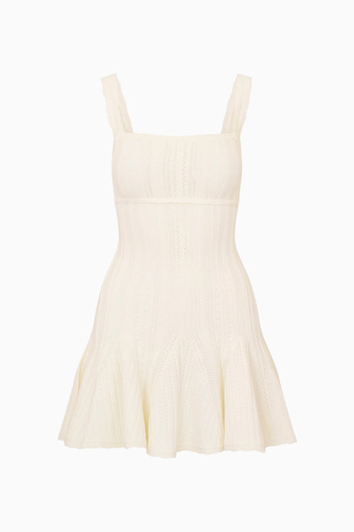 Beige dress with thin straps on a white background