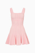 Pink dress with thin straps on a white background