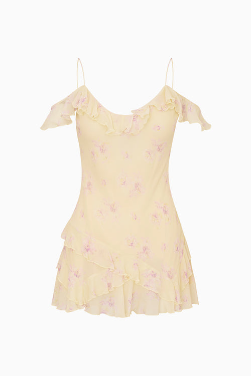 Yellow ruffle off the shoulder mini dress with floral patterns on a white background