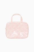 Pink textured cosmetic bag with handle on a white background