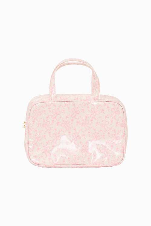 Pink textured cosmetic bag with handle on a white background