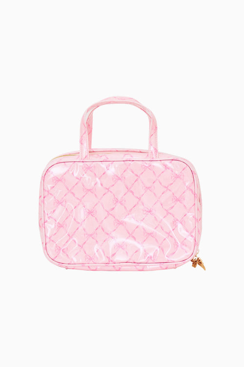 Pink bow print travel case on a white background