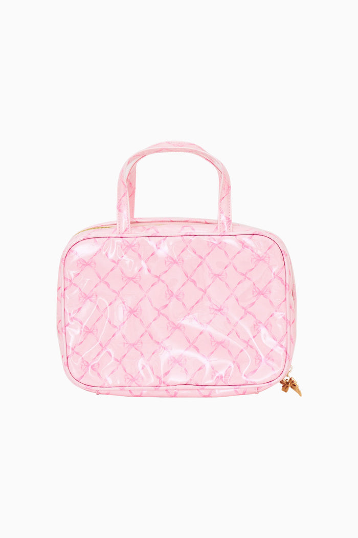 Pink bow print travel case on a white background