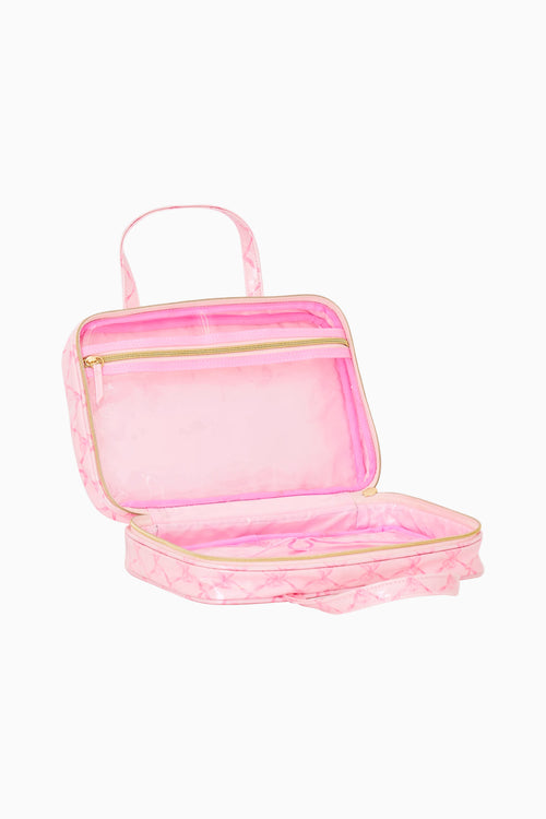 Pink cosmetic bag with gold zipper on a white background
