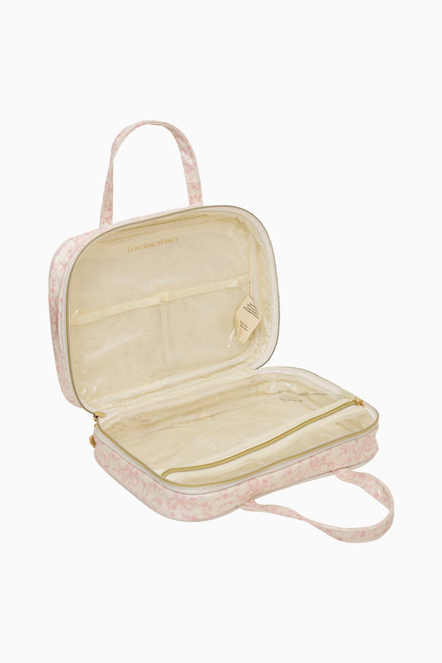 Open travel case with floral pattern on a white background
