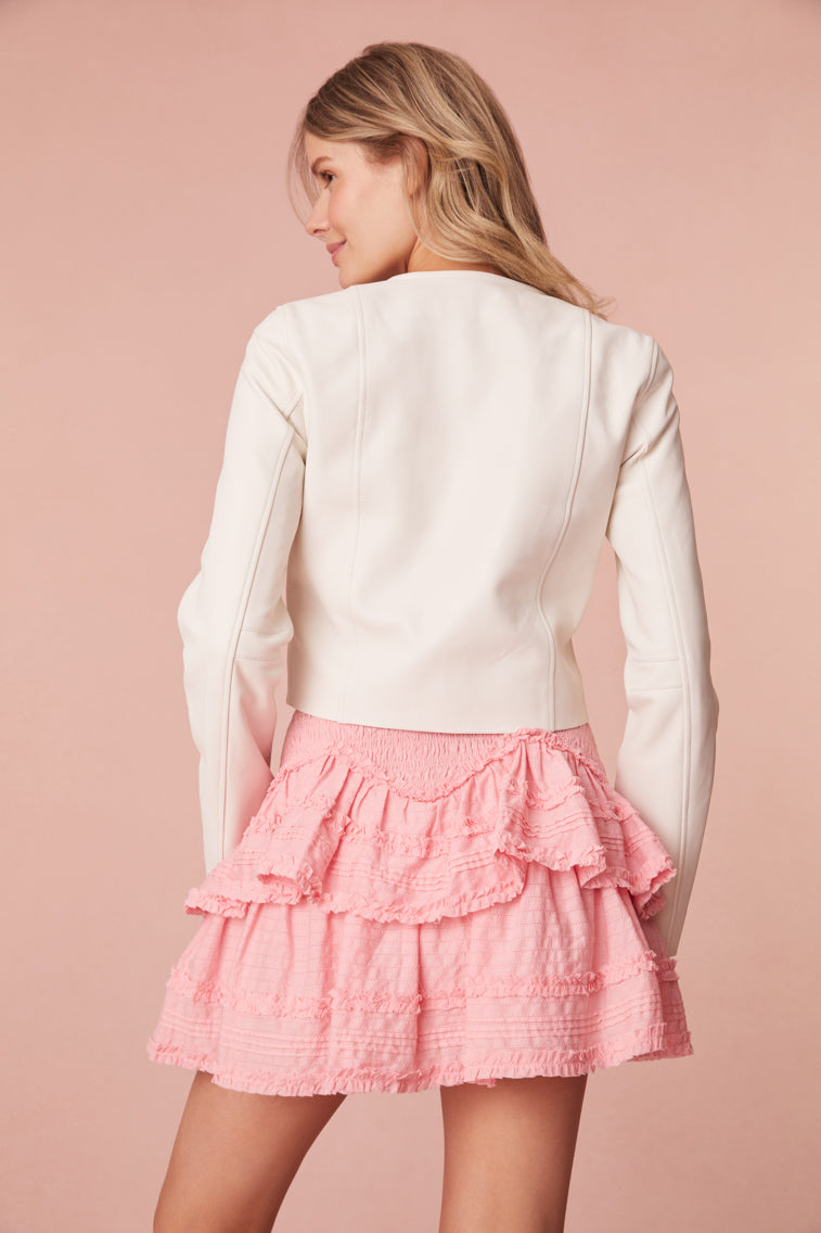 Mini skirt with stripe texture, top-applied ruffle details in a zigzag formation, and a smocked waistband.