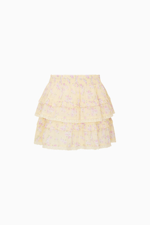 Yellow tiered skirt with floral pattern on a white background