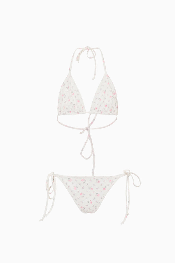 White bikini set with floral pattern on a white background