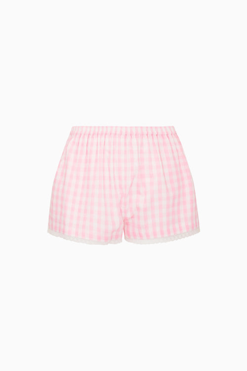 Pink gingham shorts on a white background