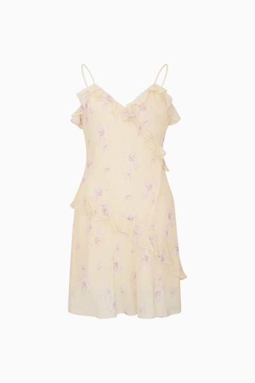 Light yellow dress with floral patterns on a white background