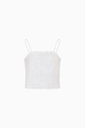 White lace camisole against a white background.