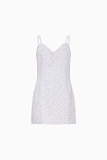 Blue slip dress with a subtle pattern on a white background