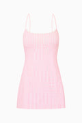 Pink gingham dress on a white background