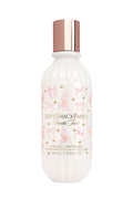 Perfume mist bottle with floral design and 'Love Shack Fancy' branding on a white background