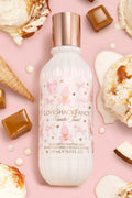 LoveShackFancy Vanilla Swift hair and body perfume bottle on a pink background with ice cream cones and caramel pieces.