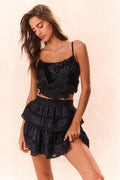 Black bow bustier top with bow-and-flounce front and thin spaghetti straps