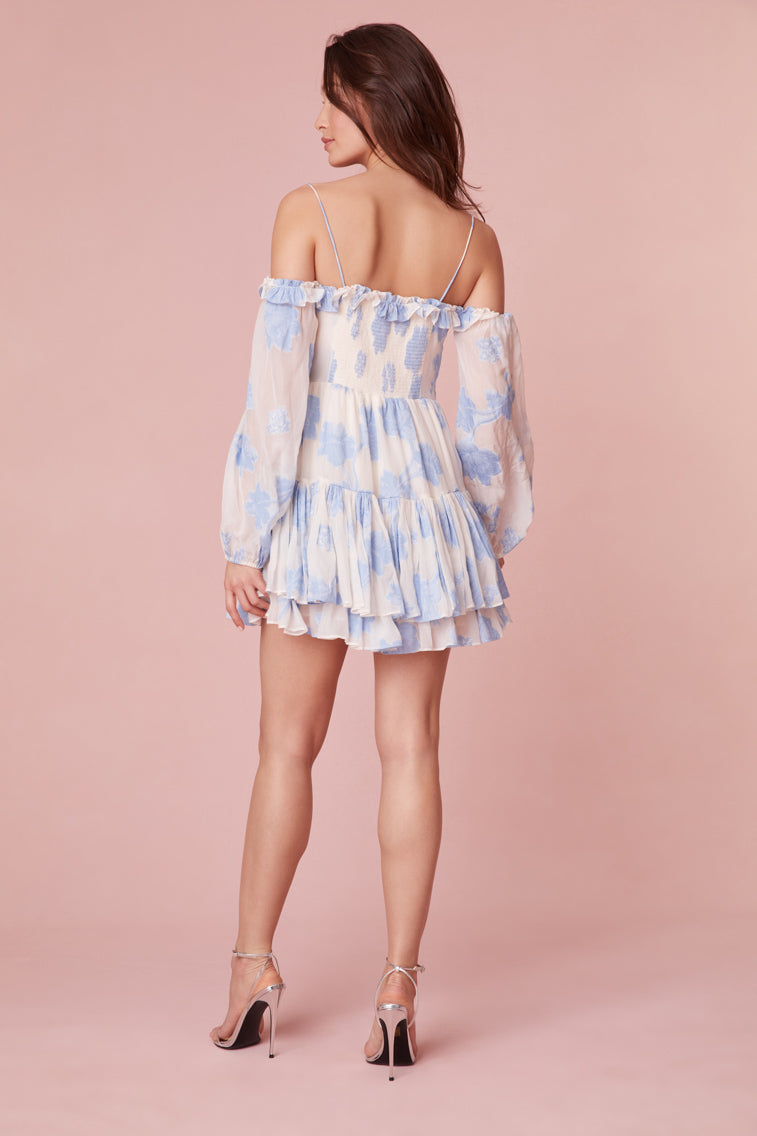 The off-shoulder mini dress with blouson sleeves, elasticated openings, and a two-tiered skirt