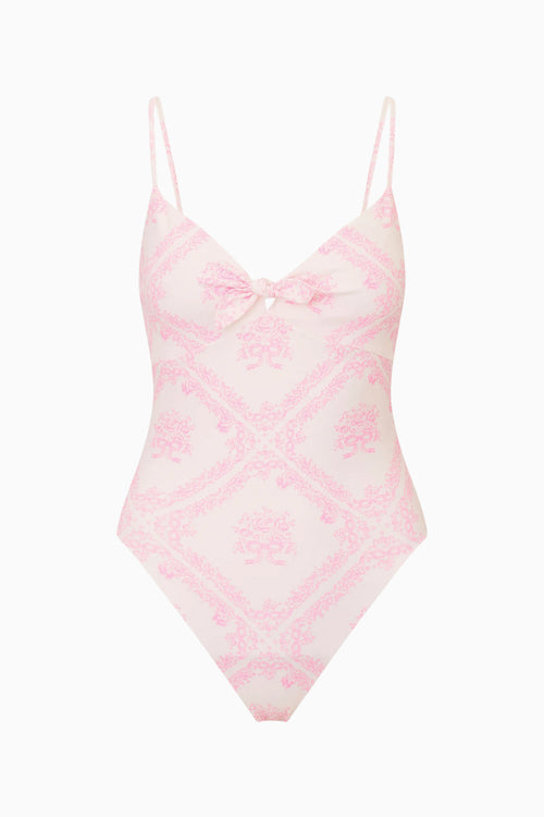 Pink and white patterned swimsuit on a white background