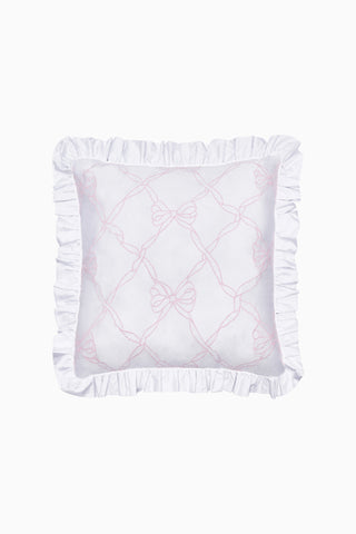 White pillow with ruffled edges and pink embroidery on a white background
