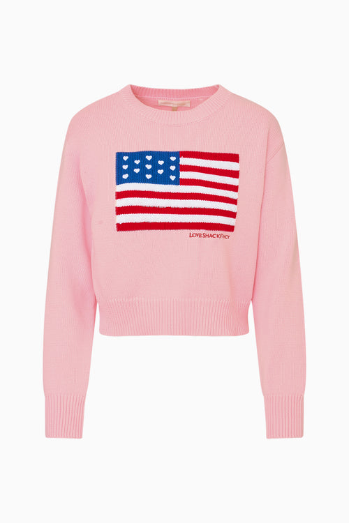 Pink sweater with American flag design on a white background