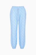 Light blue pants with a subtle pattern on a white background