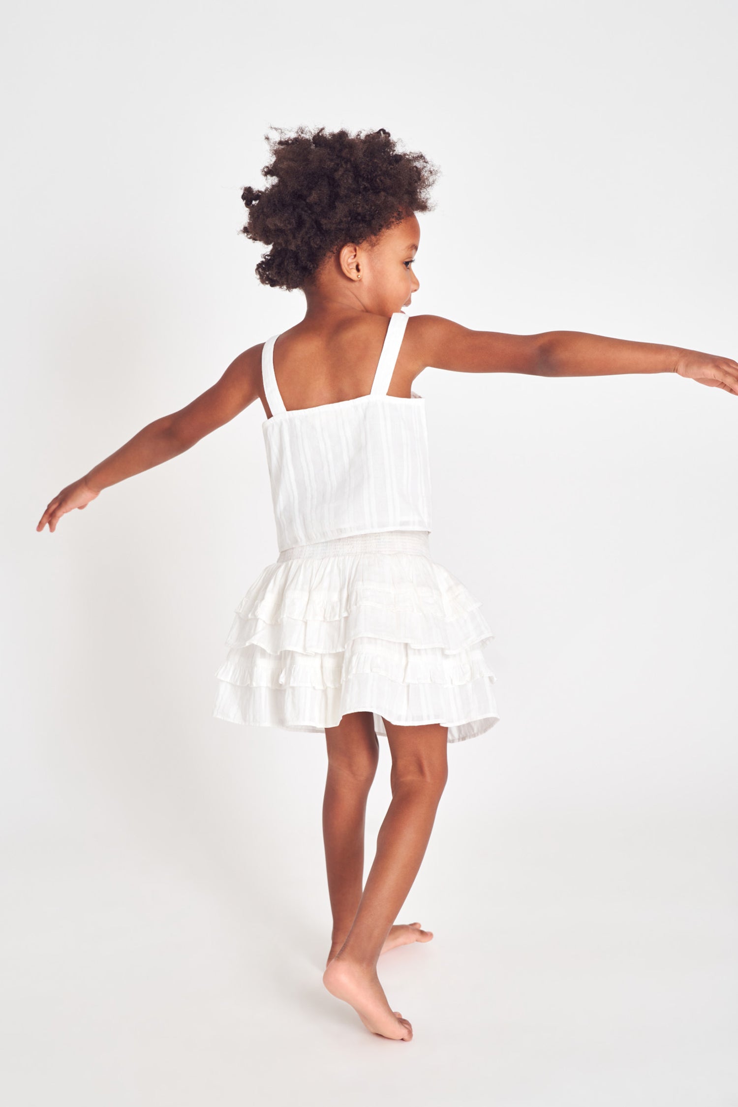 White two-tiered ruffle mini skirt.