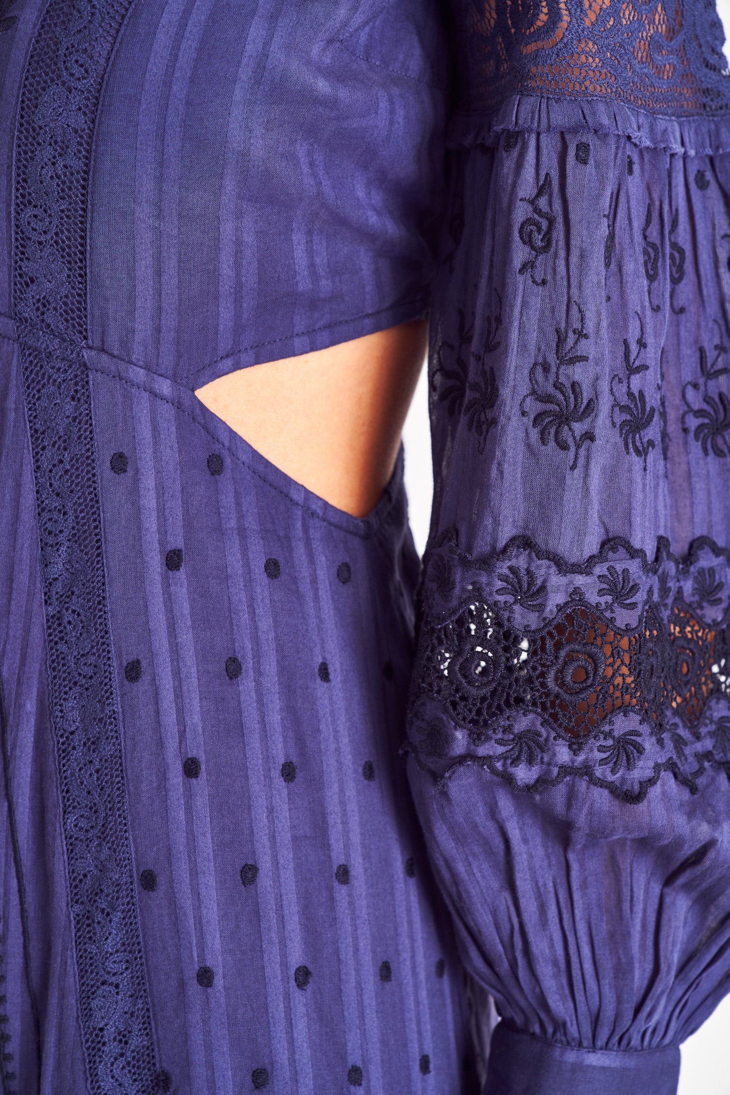 Dark blue v neck long sleeve maxi dress with cutouts.