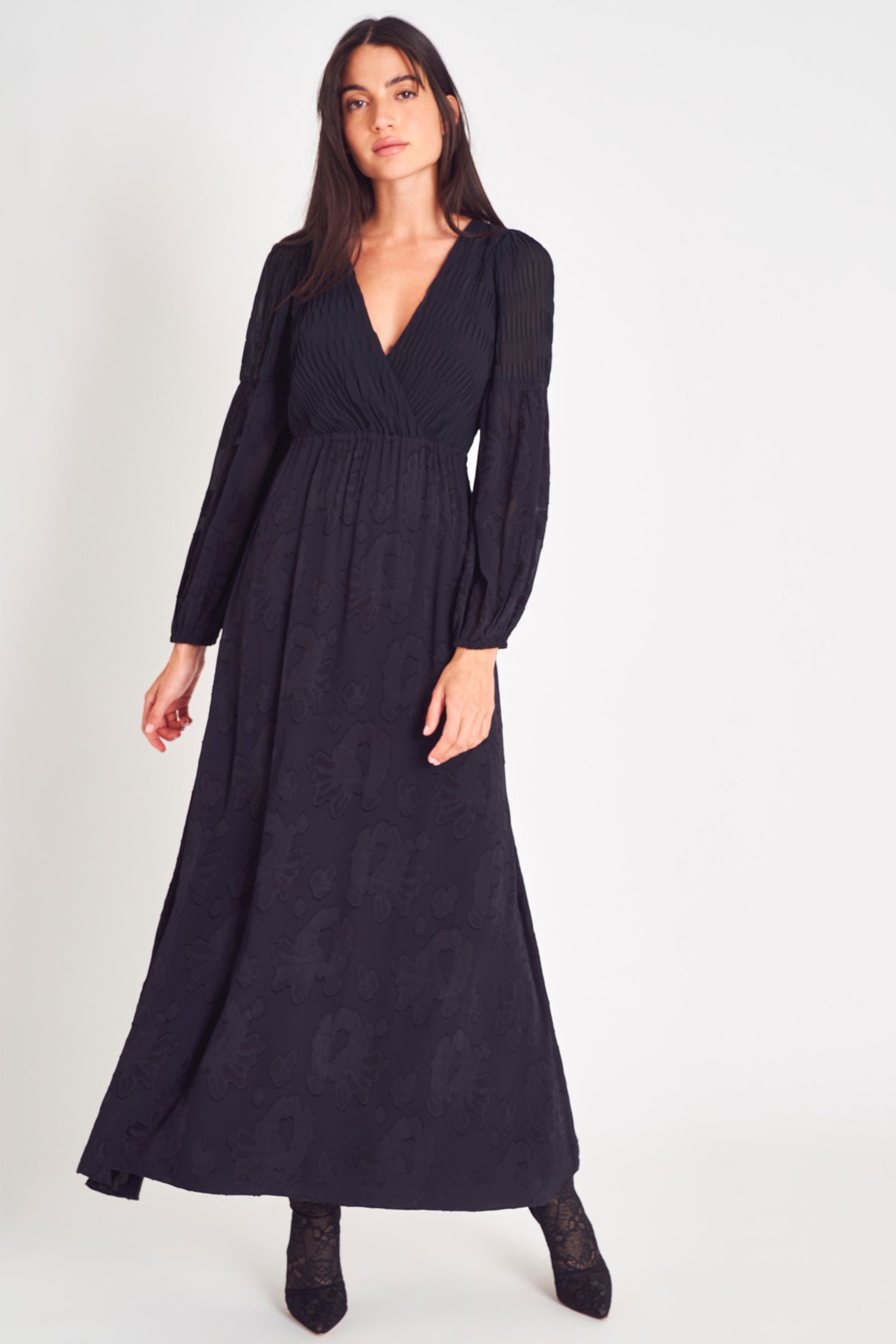 Black v neck long sleeve maxi dress with floral jacquard and pleated texture fabric.