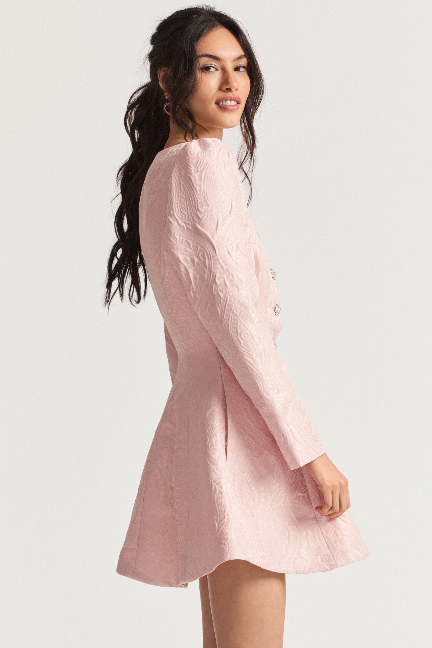 Pink mini jacket dress with paisley jacquard pattern and embellished crystal buttons, intricate body seaming to create a flawless fit.