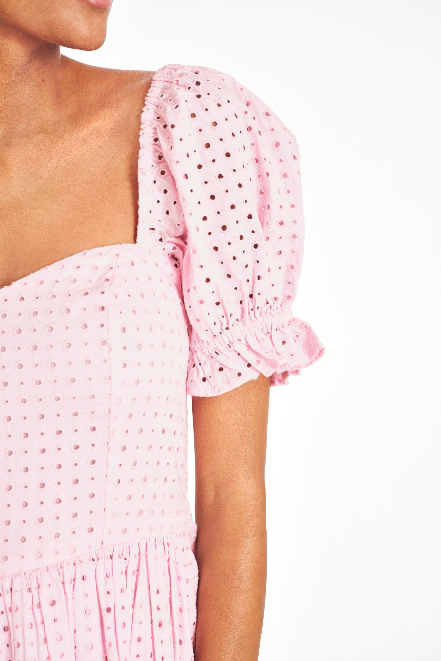 Pink eyelet dress with short puff sleeves