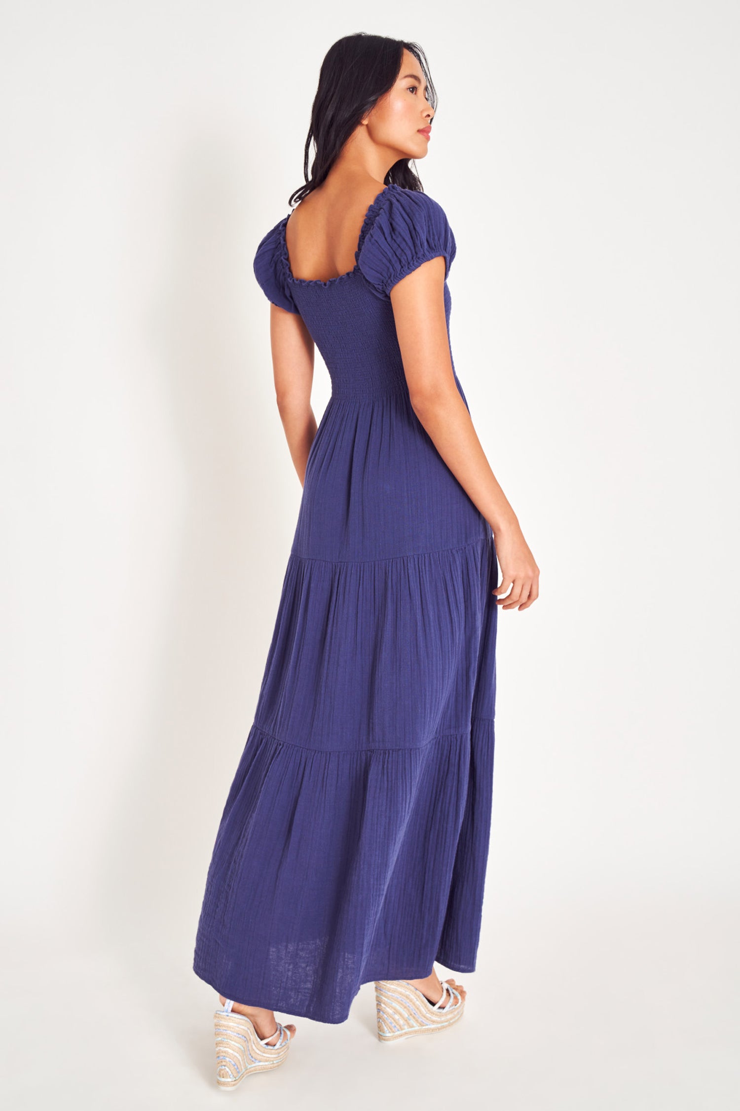 Short sleeved navy blue maxi dress with side slit.