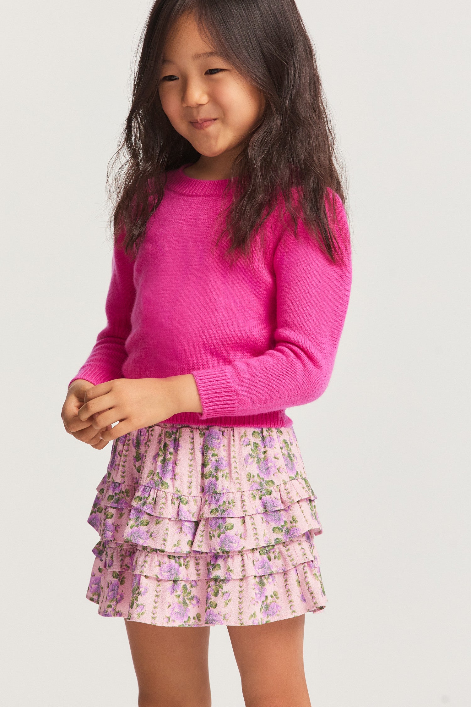 Little girls ruffle mini skirt in a pink flower print. 