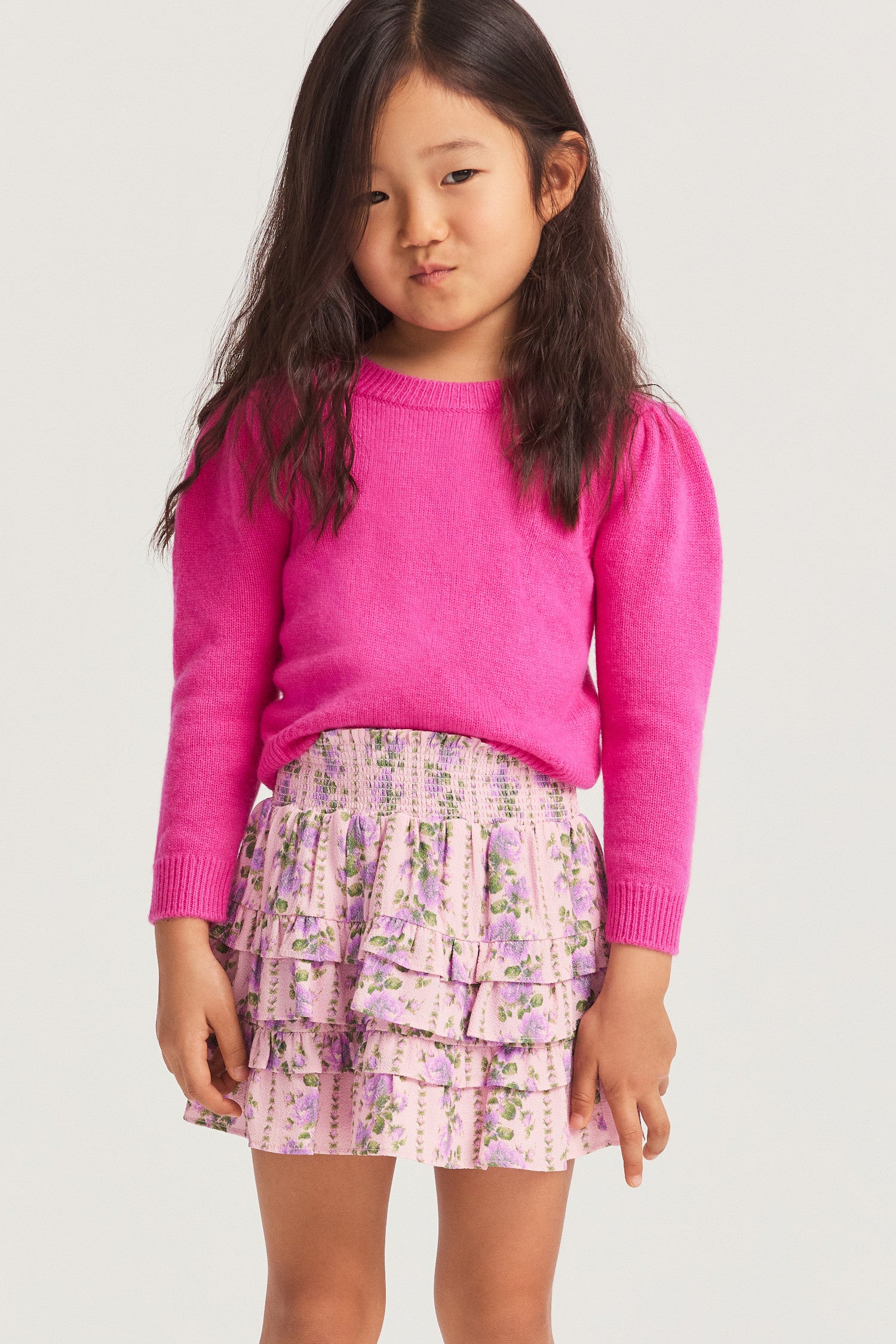 Little girls ruffle mini skirt in a pink flower print.