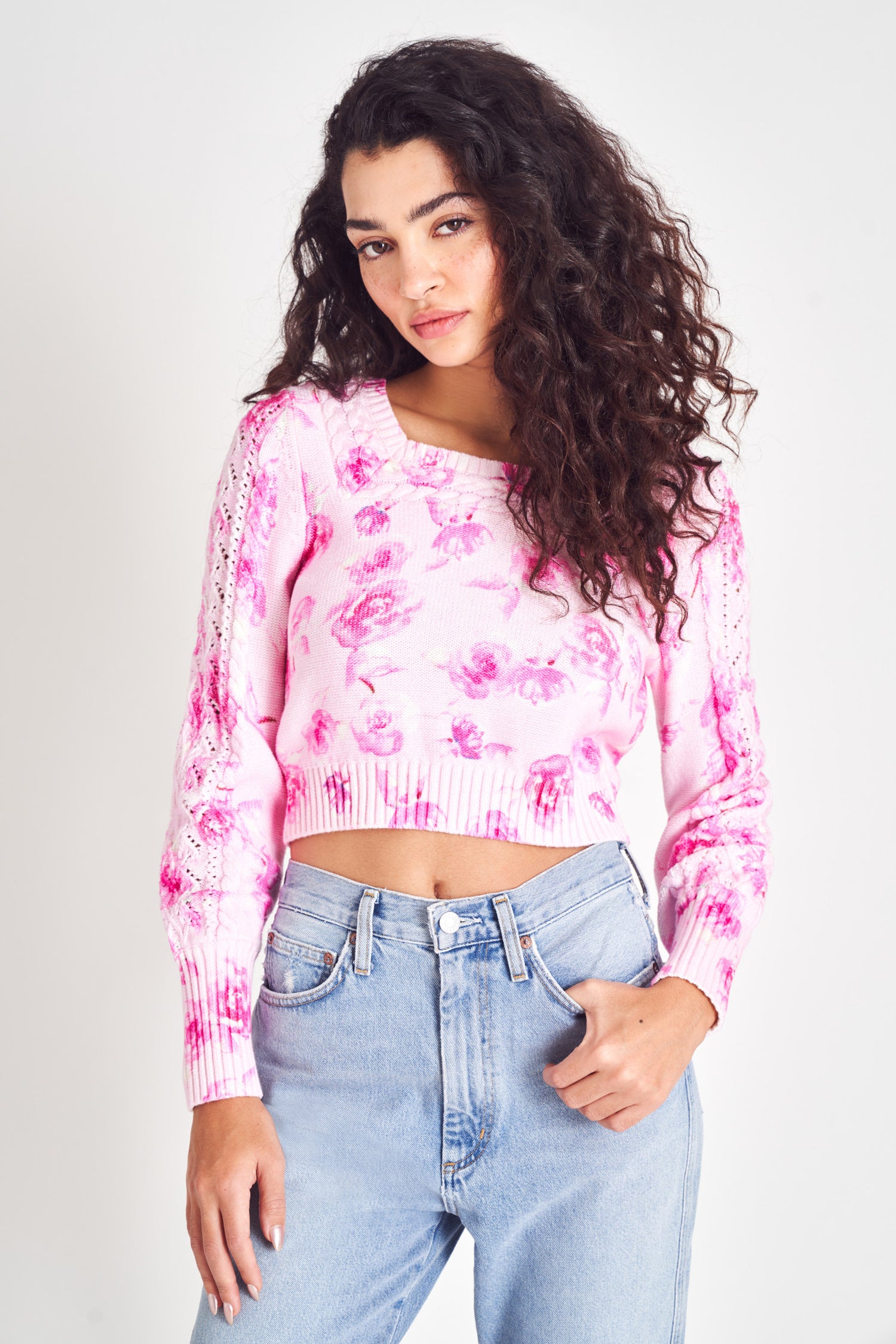 Pink floral reversible knit cropped sweater with mixed cable.