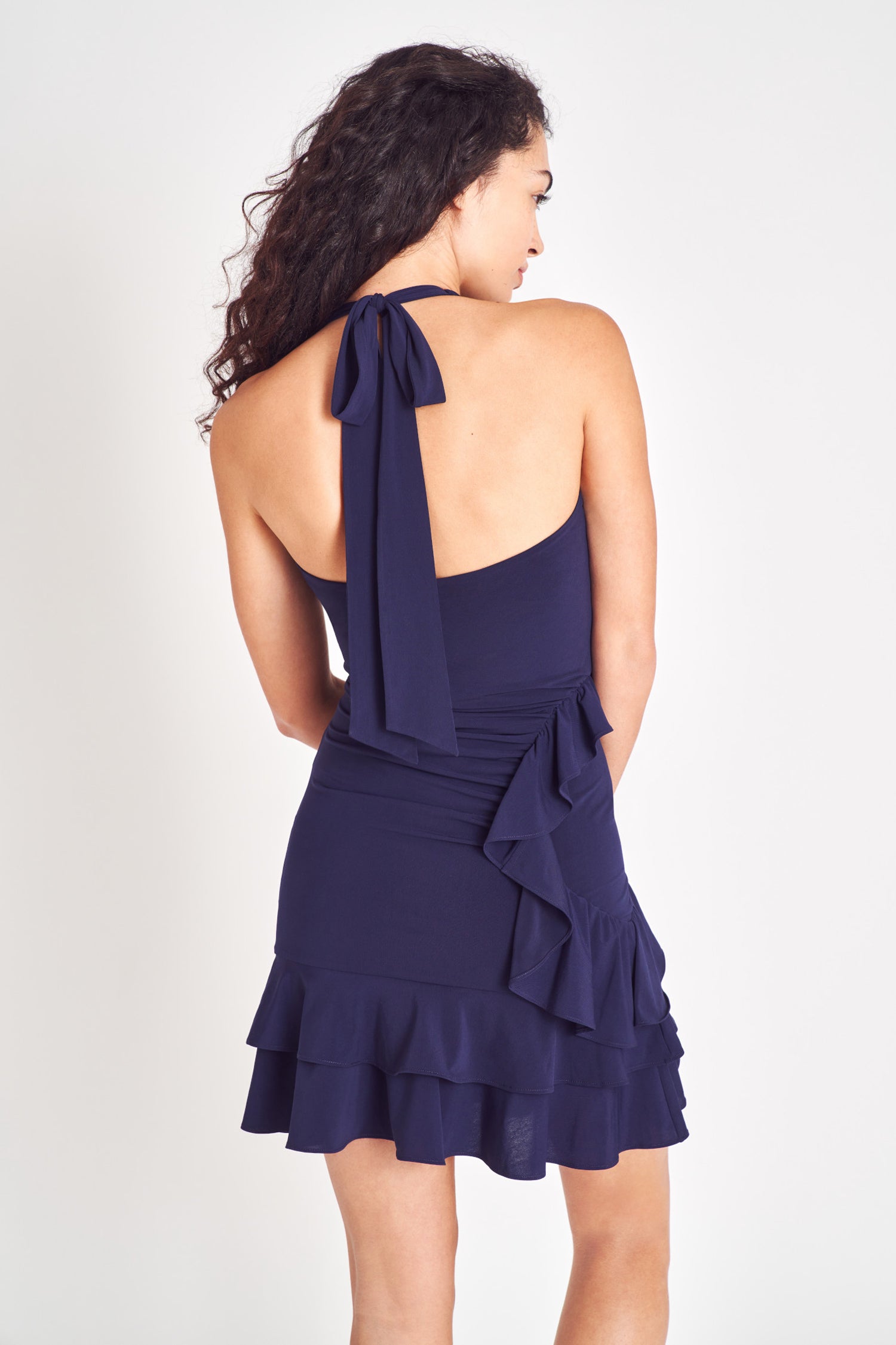 Midnight sleeveless halter mini dress featuring a double ruffle with asymmetrical hem.