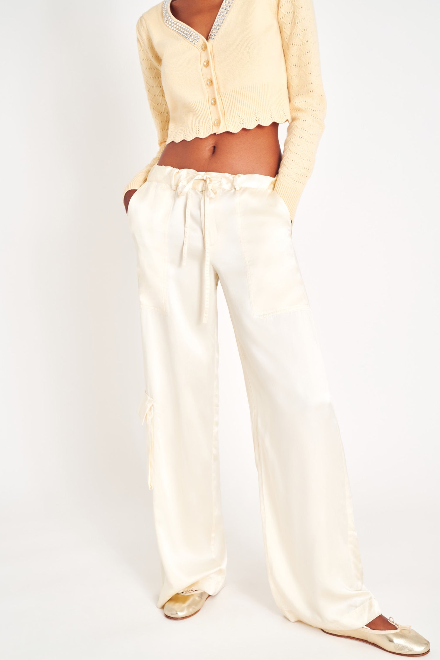 White silky charmeuse cargo pants with deep pockets.