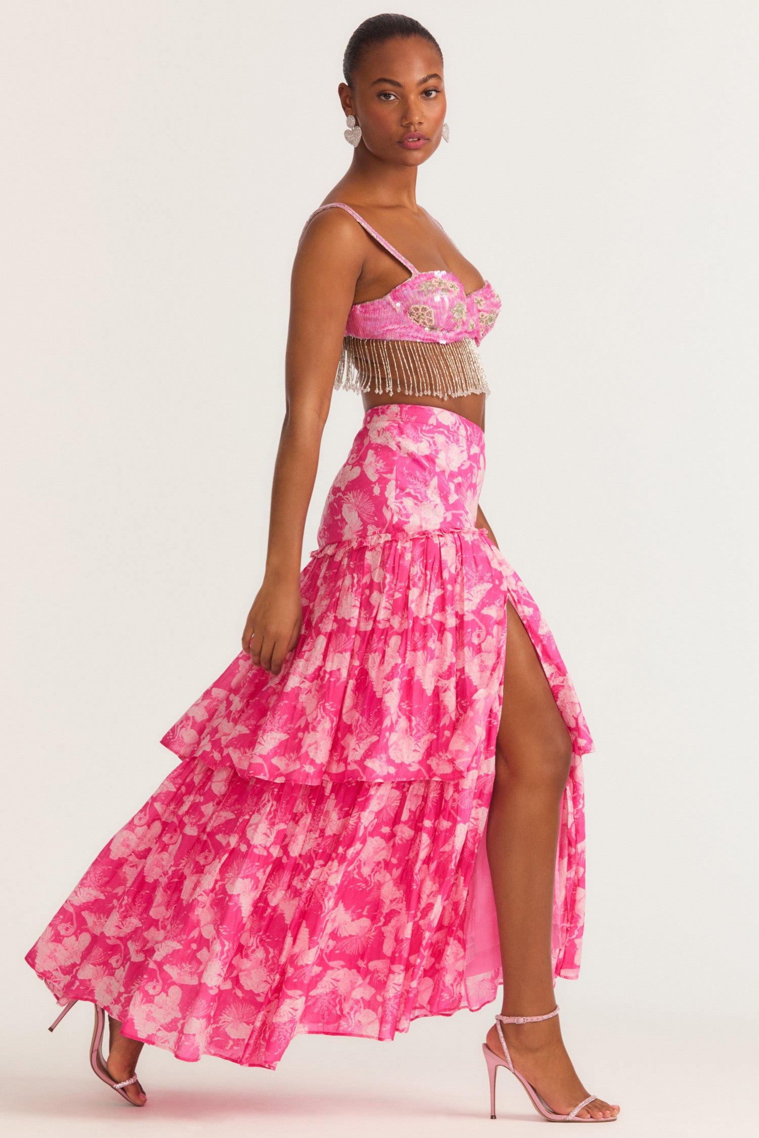 Womens pink floral cotton silk maxi skirt with leg slit and ruffle detailing.