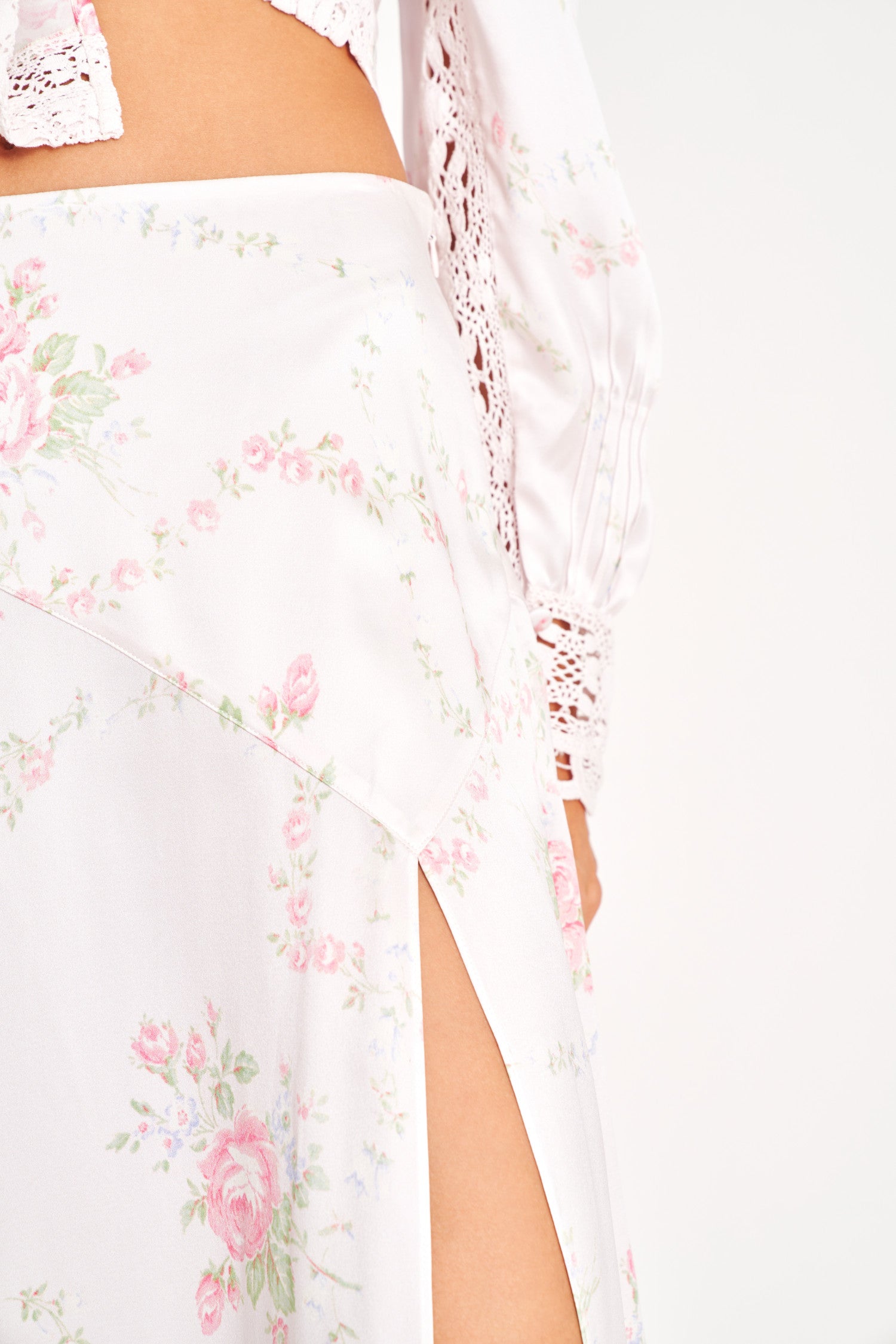 Floral silk maxi dress with slit on wearer's left.