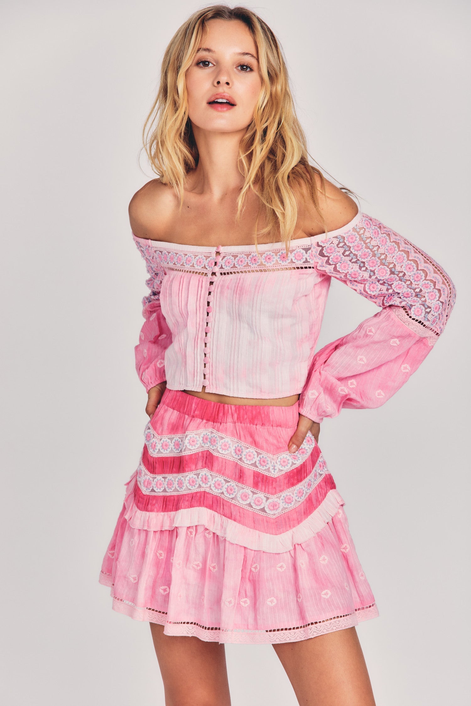 Womens pink mini skirt with lace trim and embroidery details