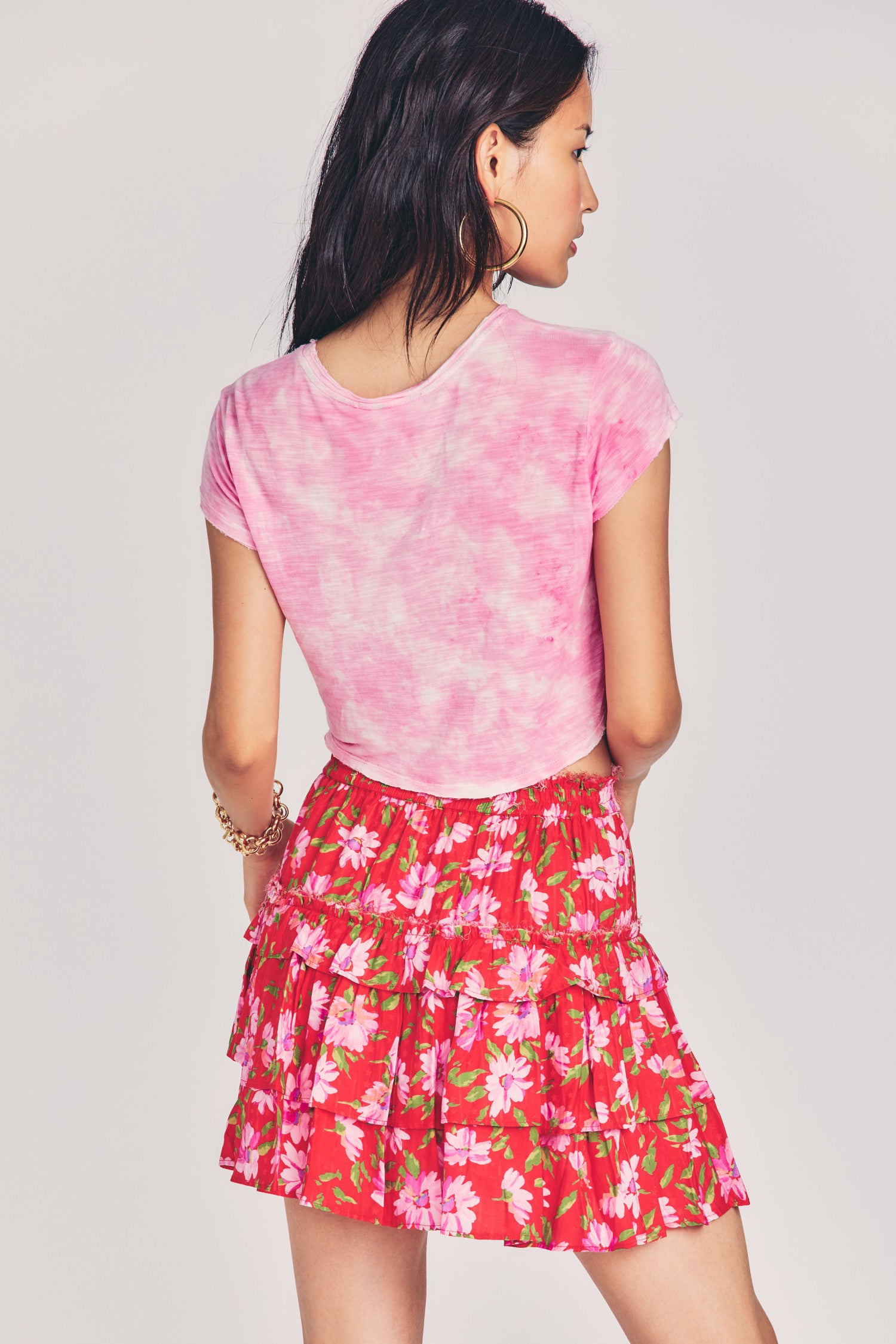 Womens red mini skirt with light pink floral print design and ruffled tiers