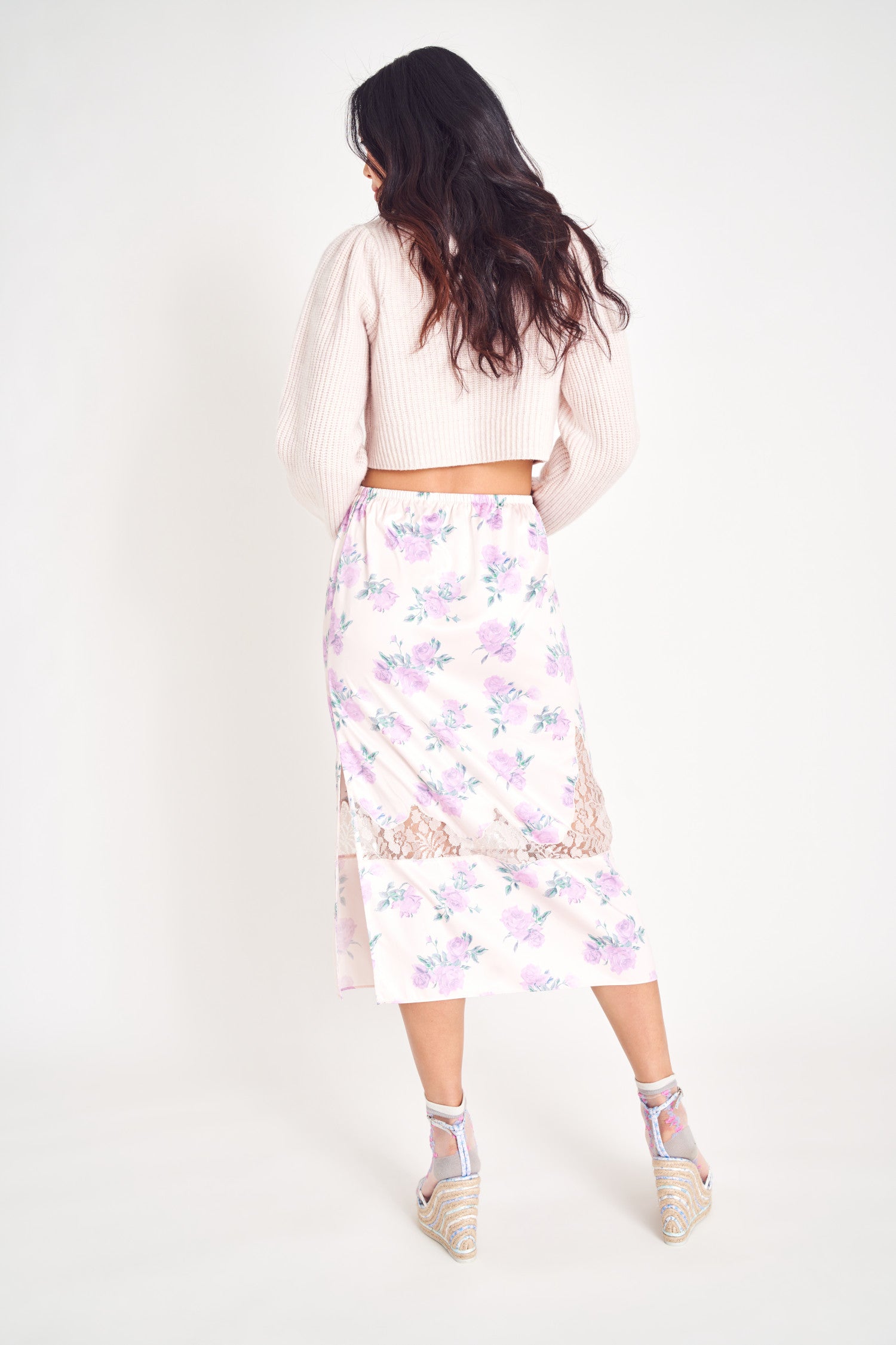 Purple floral midi skirt with lace insets.