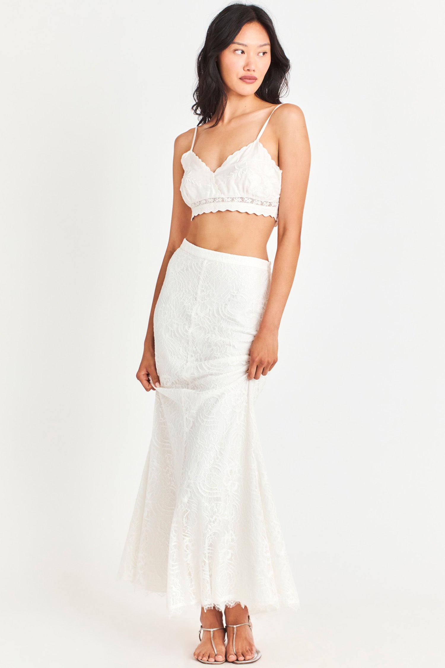 White fitted skirt features custom lace