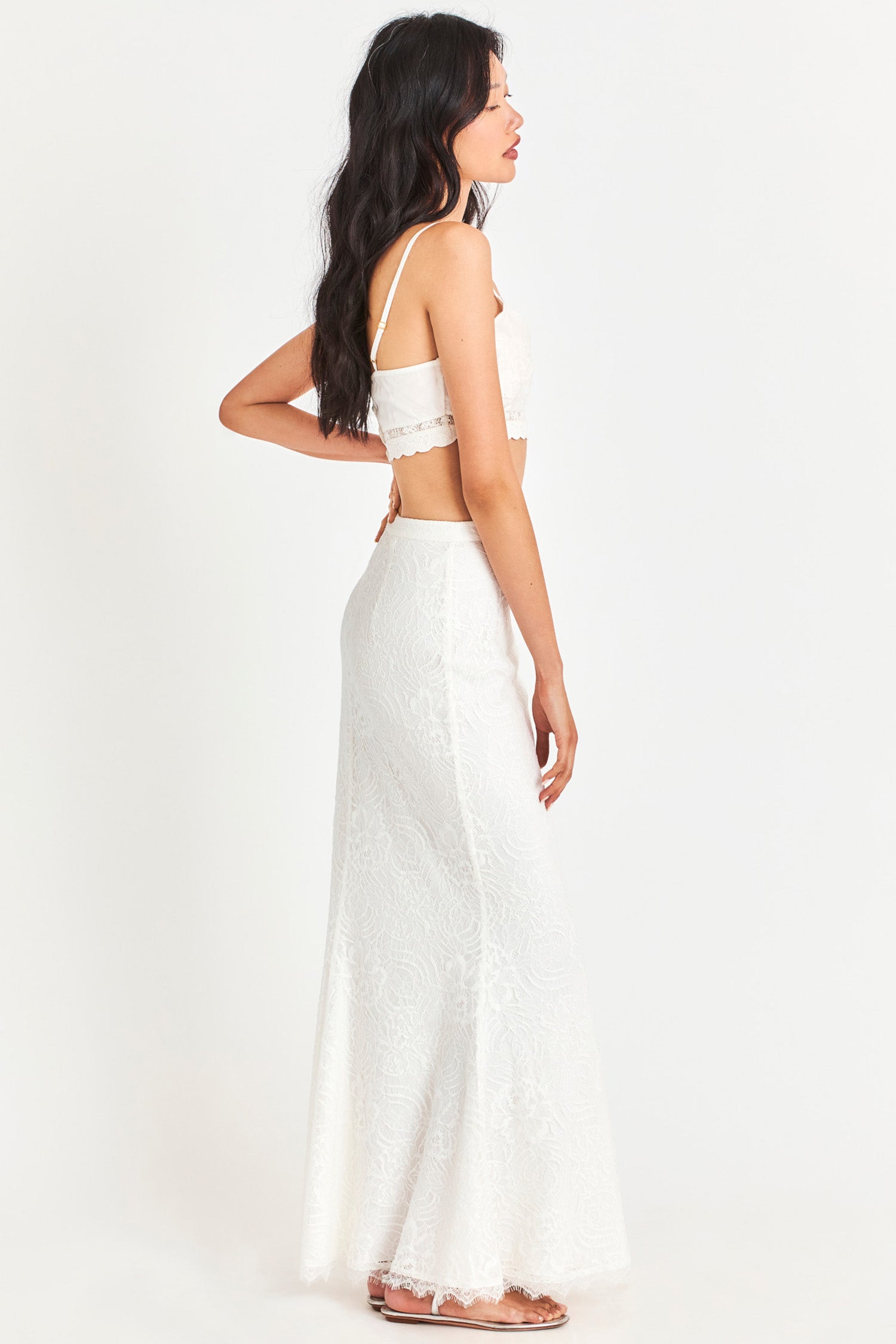 White fitted skirt features custom lace