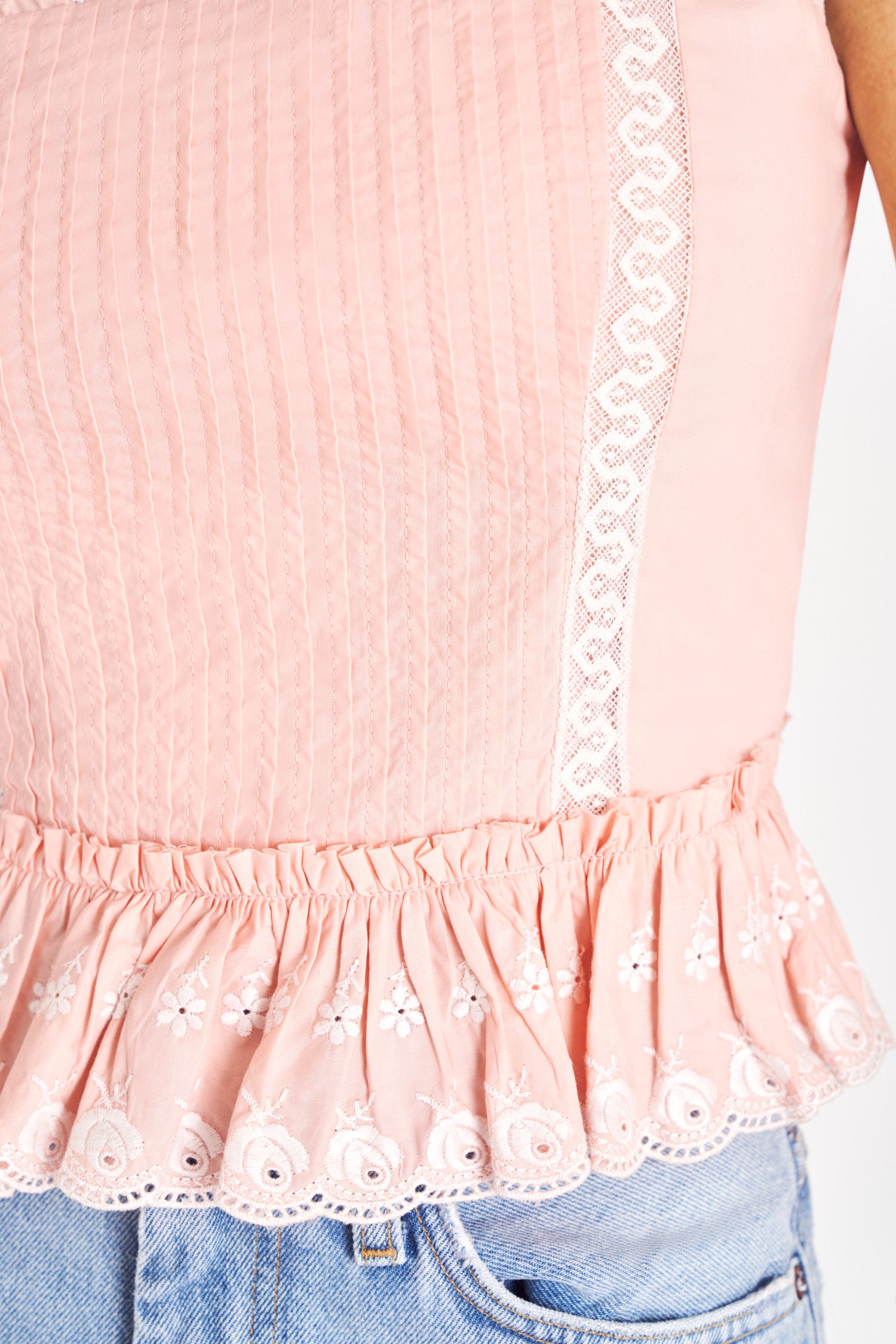 Pink cotton bustier with lace eyelet detail.